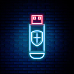 Obraz premium Glowing neon line USB flash drive and protection shield icon isolated on brick wall background. Colorful outline concept. Vector.