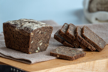 Sliced bread with sunflower seeds and sesame on a plate