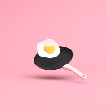 Heart shape of fried egg on a frying pan, Valentine concept, 3d rendering.