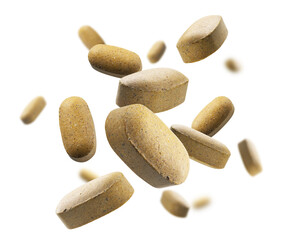 Yellow tablets levitate on a white background