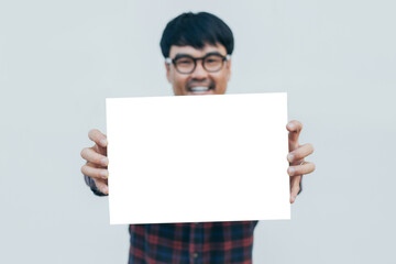 adult asian man.young male holding blank mockup.posing smiling look excited surprised thinking positive happy joy life. empty,copy space for text advertising.white background