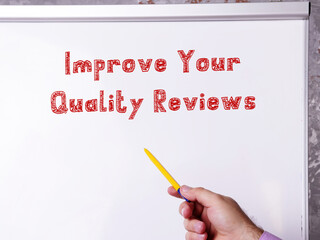 Lifestyle concept meaning Improve Your Quality Reviews with inscription on the piece of paper.