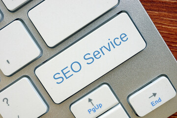 Financial concept about SEO Service  with sign on the piece of paper.