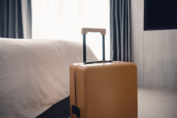 Fototapeta premium Suitcase or luggage bag in a modern hotel room.