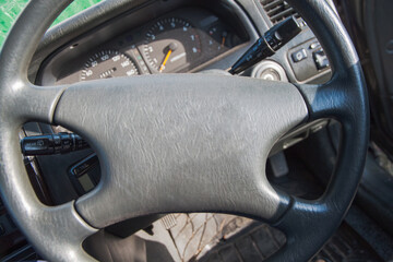 Close-up of the steering wheel of the car