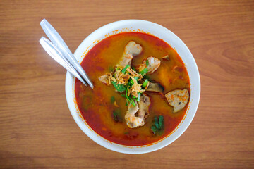 Sundanese famous food called Seblak, spicy taste, made from wet crackers, chicken feet, and vegetables.
