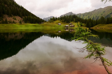 reflection from houses and mountains in a lake