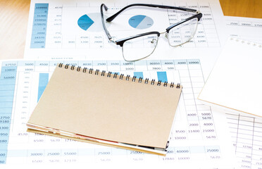 Notepad with pencil and office tools. BUSINESS and finance concept.