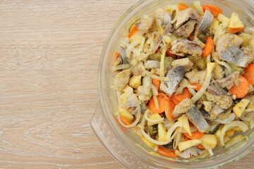 fresh homemade herring salad with apple and onions
