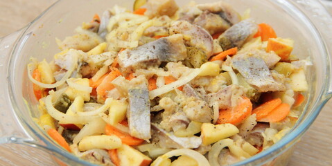 fresh homemade herring salad with apple and onions