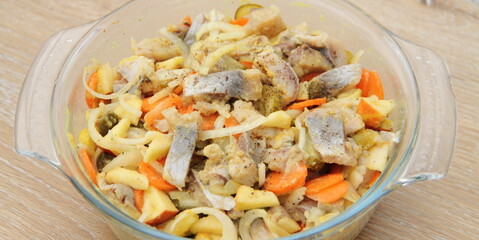 fresh homemade herring salad with apple and onions