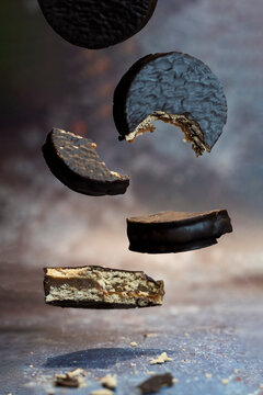 Argentine food, chocolate alfajores falling with bites, delicious