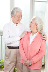 A group photo of a happy old couple