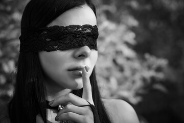 Woman with blindfold eyes, sensuality and woman's erotic desire concept.