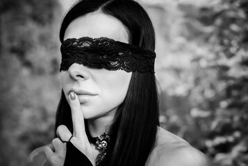Woman with blindfold eyes, sensuality and woman's erotic desire concept.