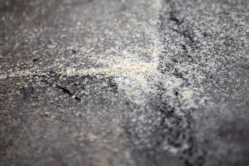 Sidewalk is sprinkled with anti-slip material. Weather, frost and slippery