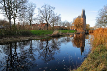 Reflections ot the twin towers of the gate Nobelpoort in Zierikzee, Zeeland, Netherlands