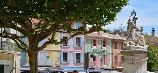 Old town of Orange in Provence-Alpes-Côte d'Azur,  pastel colored old houses with wooden shutters,...