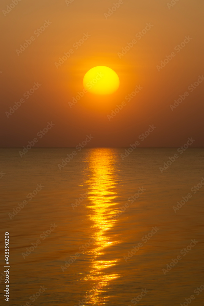 Poster Sunset at the lake with reflection light on water surface.