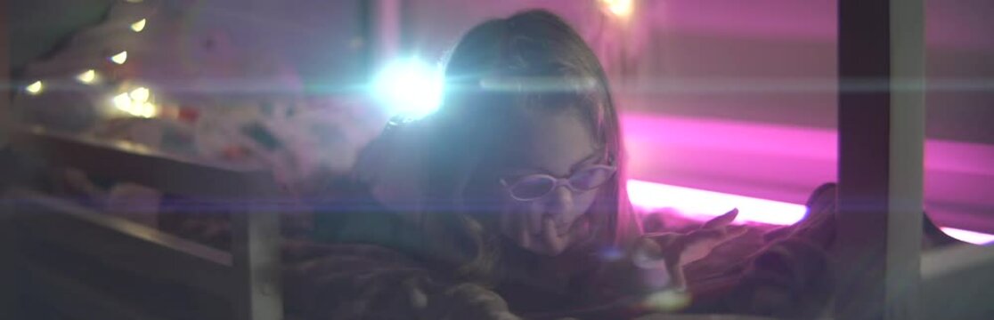  Little girl with tablet on bed anamorphic 2x