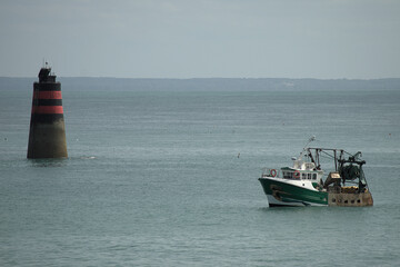 fishing boat entering the harbor