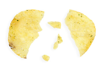 Potato chips with crumbs and leftovers isolated on white background, top view. Cracked potato chips isolated on white background, top view.