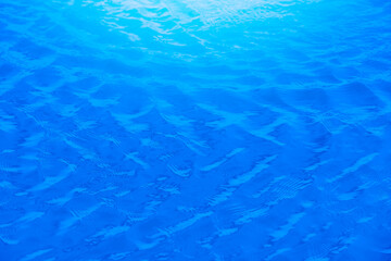 Blue water reflection With daylight during the day.soft focus..