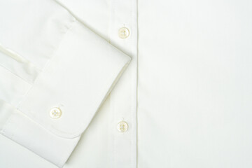 A fragment of a women office blouse with buttons and sleeve cuff. Premium quality white cotton fabric easy to iron.