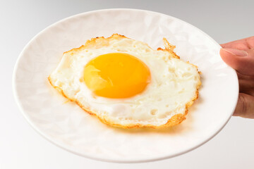 Fried eggs on white background