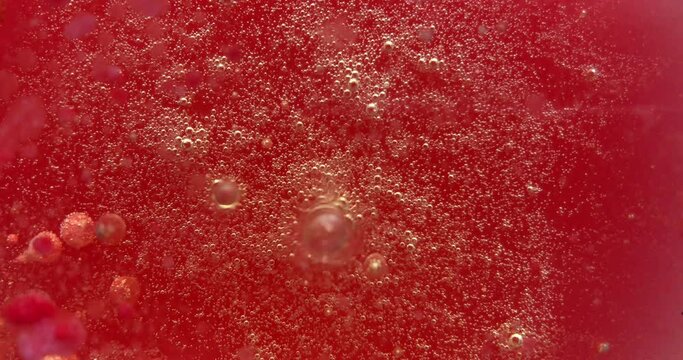 Colorful soap foam with popping bubbles background. Abstract biological structure, macro molecule pattern. Bright ink filling a mass of small big bubbles formed in liquid. Natural, unusual wallpaper