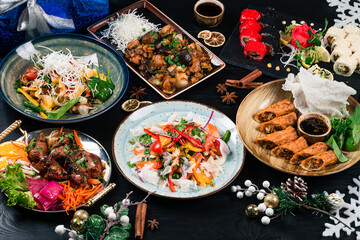 Concept Chinese new year table set up and Chinese dishes. table with dishes for celebrating Asian New Year