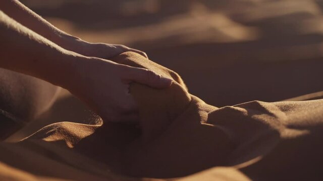 Woman'S Hands Cupping Desert Sand