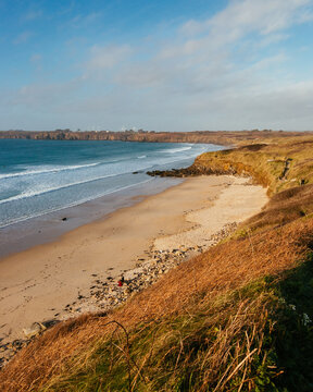 Waves are coming in the bay and crashing on the beach of Les Blancs Sablons, Finist&egrave;re, Bretagne, France