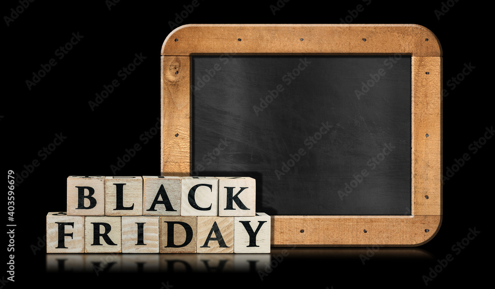 Poster text black friday made of wooden blocks in front of a blank blackboard with copy space. isolated on 