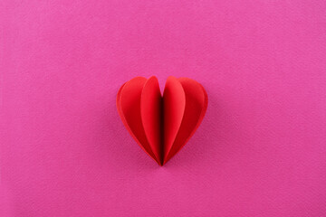 Pink background with red pepper hearts for Valentine's day