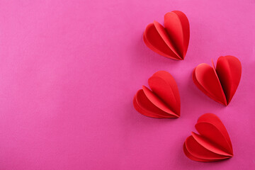 Pink background with red pepper hearts for Valentine's day