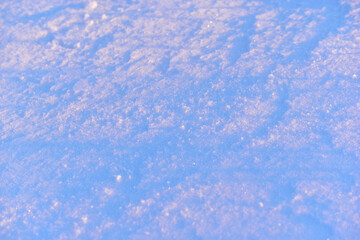 Fototapeta na wymiar Sunny snow in winter on the face in the sun