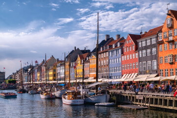 Fototapeta premium Scenic summer view of color buildings and boats of Nyhavn in Copenhagen, Denmark