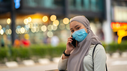 Young teenager waiting vehicle at stop station.