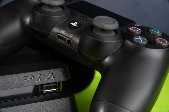 Araras, S&atilde;o Paulo, Brazil. November 18, 2020. video game control over the console on green surface, selective focus.