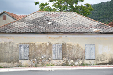 Fototapeta na wymiar Old house with shuttered windows, Montenegro.