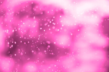 Pink glitter vintage lights background. White bokeh on pink background.