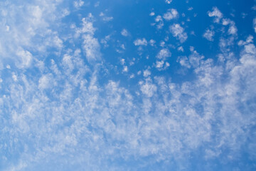 Blue clean sky with white clouds background