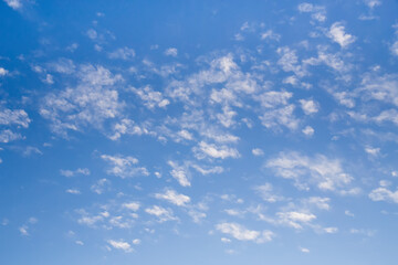 Blue clean sky with white clouds background