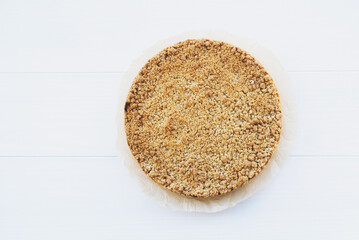 Freshly baked homemade double crutsed apple crumb pie on white background. Copy space. Sweet food.