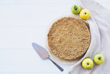 Freshly baked homemade double crutsed apple crumb pie on white background, top view.. Sweet food,...