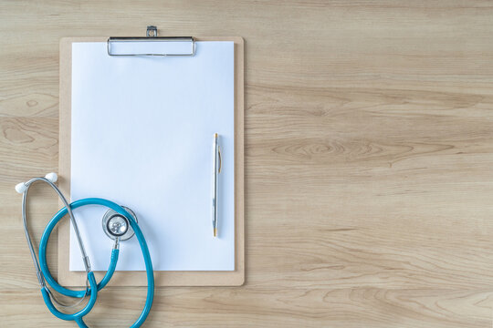 Medical notepad clipboard background with blank note pad paper for patient health record exam or diagnosis on doctor work desk for healthcare copy space