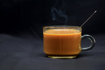 Cup of coffee on black background