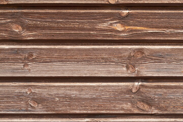 Old brown wooden texture background with space for text. Top view of natural tree plank. Grunge dark wooden background. The surface of the old brown wood. Vintage rustic style. Wooden tiles pattern