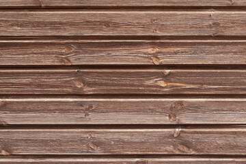 Fototapeta premium Old brown wooden texture background with space for text. Top view of natural tree plank. Grunge dark wooden background. The surface of the old brown wood. Vintage rustic style. Wooden tiles pattern